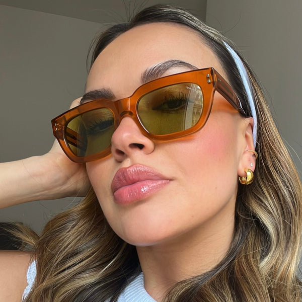 Ameos Forever collection Eli model. Transparent caramel frames with light green lenses. Front view. Genderless, gender neutral eyewear