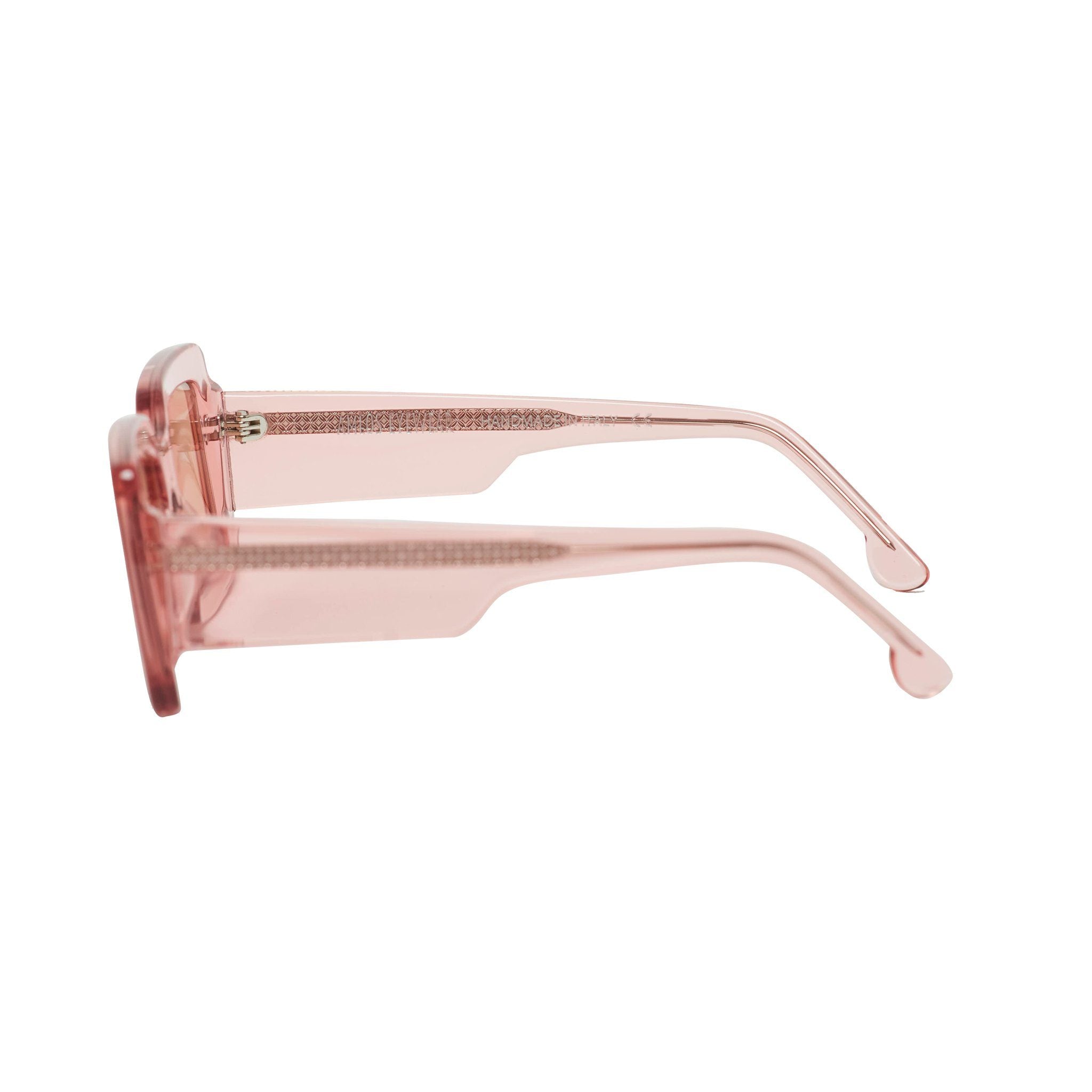 Transparent pink frames sunglasses with pink lenses. Side view