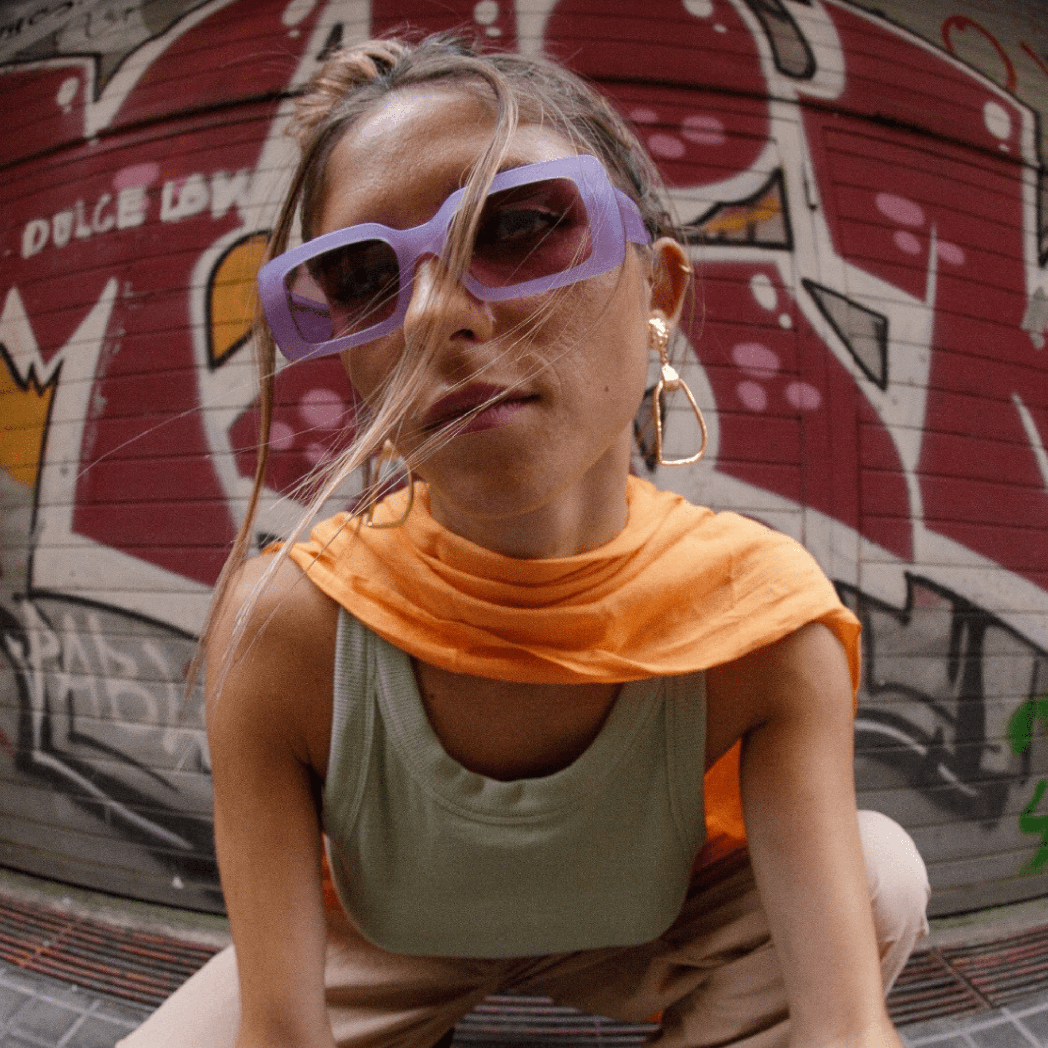 Purple sunglasses frames with pink lenses handmade in italy. Female model