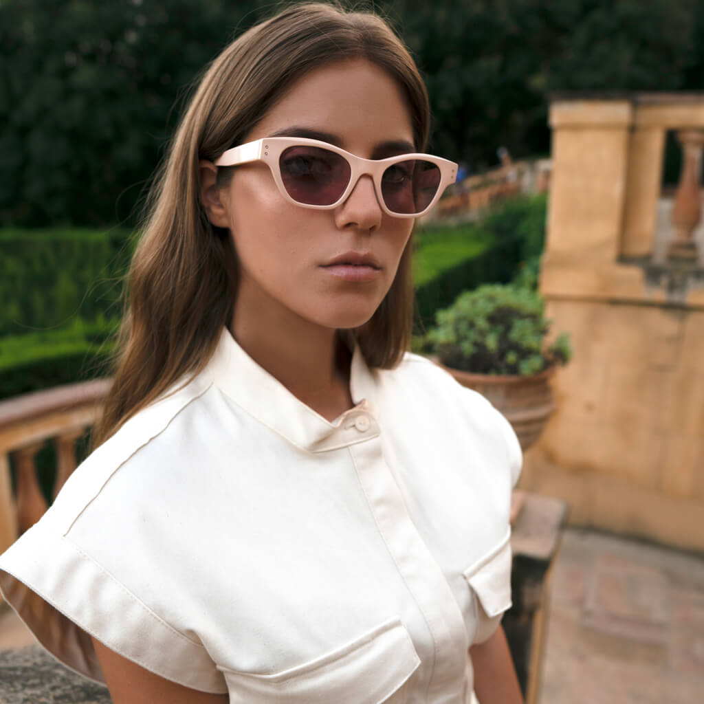 Girl model wearing Diva sunglasses in white vest
