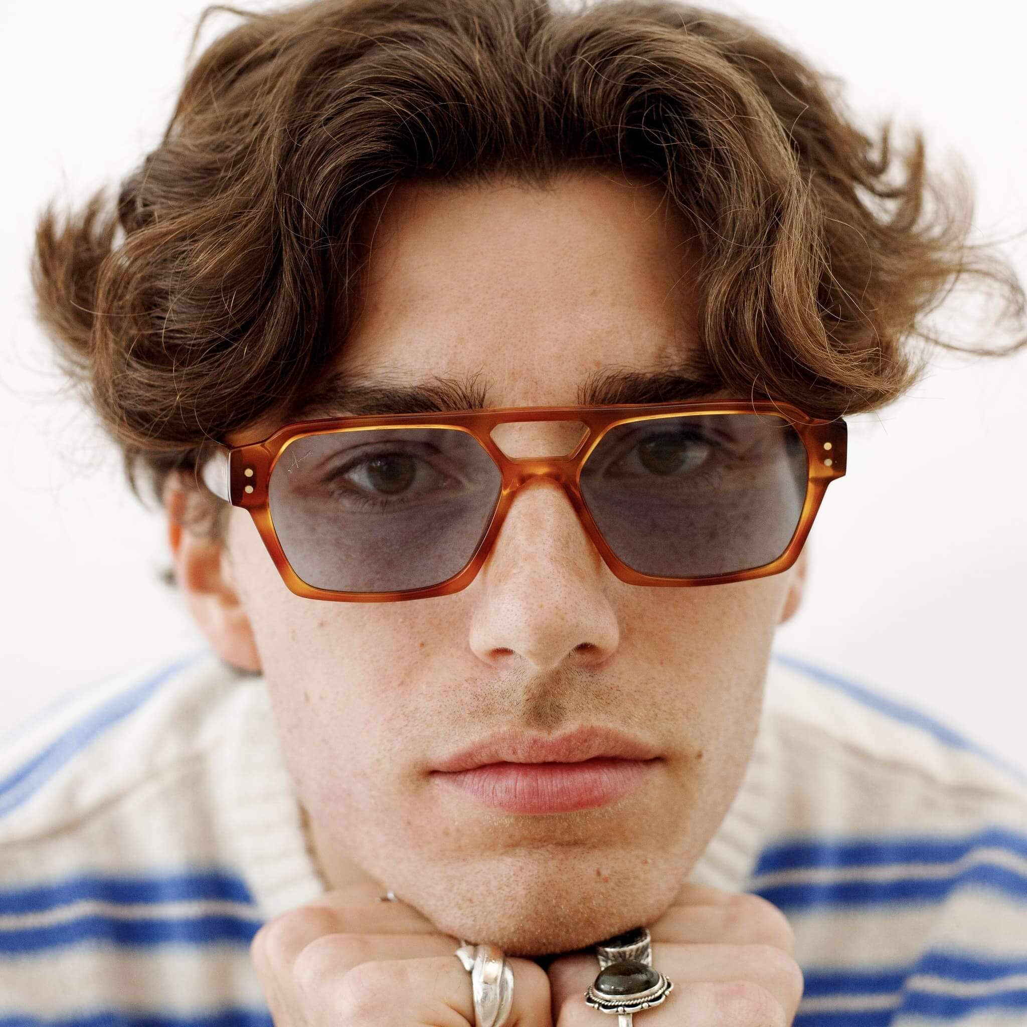 Male model in Ego sunglasses in tortoise and light blue from Ameos close up