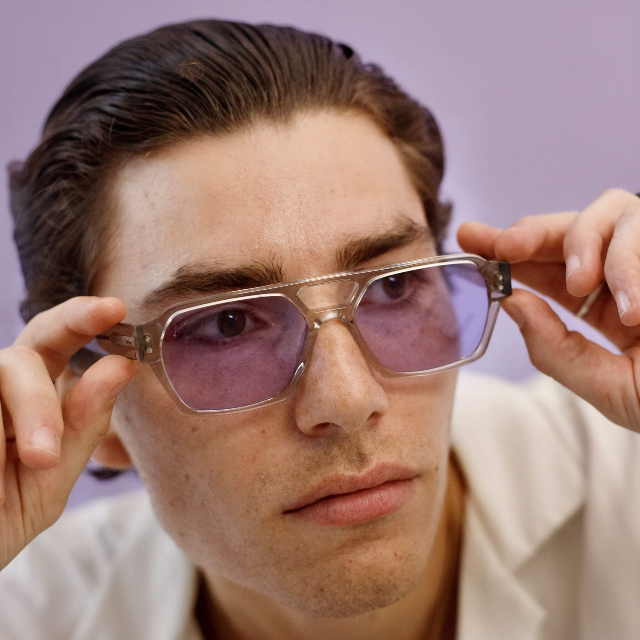 Male model in Ego sunglasses transparent grey and light purple from Ameos