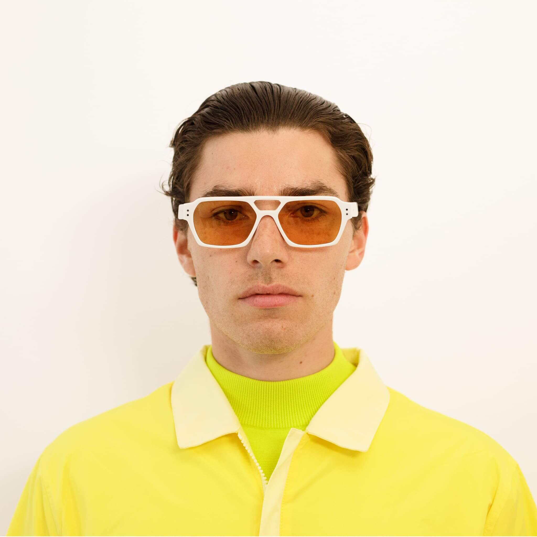 Male model in Ego sunglasses in white and orange from Ameos