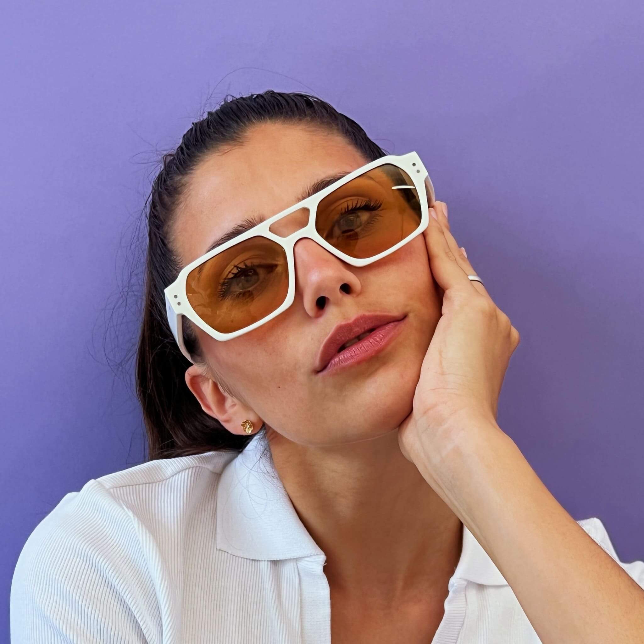 Female model in Ego sunglasses in white and orange from Ameos