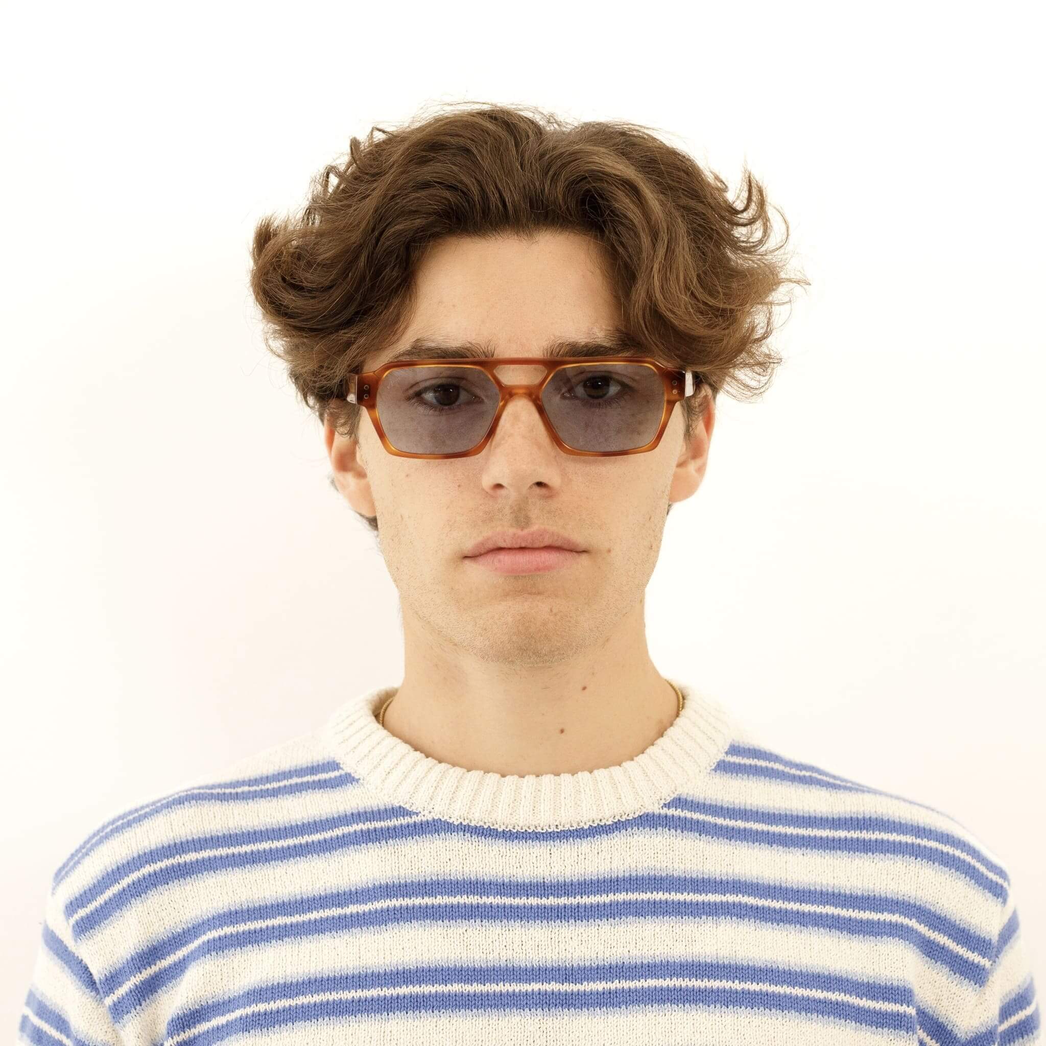 Male model in Ego sunglasses in tortoise and light blue from Ameos